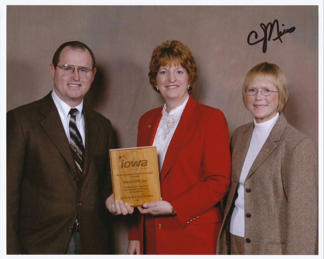 Tim and Diane Burget receiving the Century Business of Iowa award for Burget Mill, Inc. in 2002
