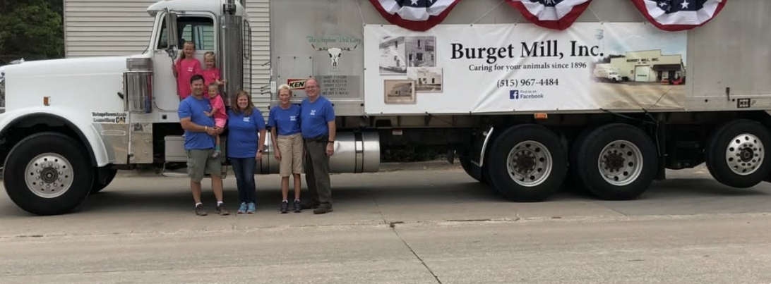 The Burget family standing in front of the Burget Mill Inc. delivery truck